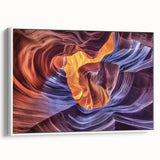 Framed canvas artwork depicting a stunning landscape of colorful canyons, showcasing rich hues of orange and blue, perfect for enhancing home decor.