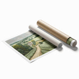 Landscape wall art print showcasing a serene countryside scene with lush green fields and a vibrant blue sky, rolled for easy storage and transport, perfect for home decor.