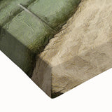 Close-up of a stretched canvas wall art depicting a serene countryside landscape with vibrant greens and blues, perfect for home decor in living spaces.