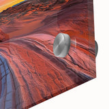 Close-up of a vibrant desert landscape acrylic artwork showcasing warm hues of orange and yellow, framed in sleek glass, ideal for modern home decor.