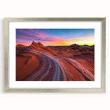 Framed desert landscape artwork with a silver mat, showcasing vibrant colors and intricate details, ideal for home decor or office enhancement.