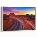 Framed canvas artwork depicting a vibrant desert landscape with warm sand tones and striking blue sky, elegantly displayed from a white side view, perfect for home decor.