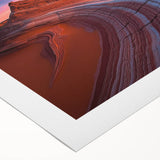 Vibrant rolled canvas showcasing a stunning desert landscape design, featuring rich warm tones of orange and yellow, elegantly packaged in a protective cardboard tube.