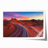 Desert landscape rolled print showcasing vibrant hues of orange and yellow, capturing the serene beauty of sand dunes under a clear blue sky, ideal for home decor.