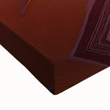 Close-up of a stretched canvas artwork depicting a vibrant desert landscape with warm hues of orange and yellow, showcasing intricate details and textures, ideal for home decor.