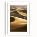 Framed landscape artwork depicting serene sand dunes in soft beige tones, accented with a white mat for an elegant presentation, perfect for home decor.
