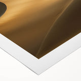 Stunning rolled canvas artwork depicting a serene desert landscape with golden dunes under a vibrant sunset, elegantly packaged for safe delivery.