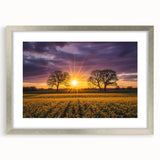 Silver-framed landscape artwork showcasing vibrant green fields under a clear blue sky, elegantly matted for a polished presentation, perfect for home decor.
