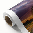 Vibrant rolled canvas showcasing a serene landscape with rolling green fields under a clear blue sky, elegantly packaged in a protective cardboard tube for safe delivery.