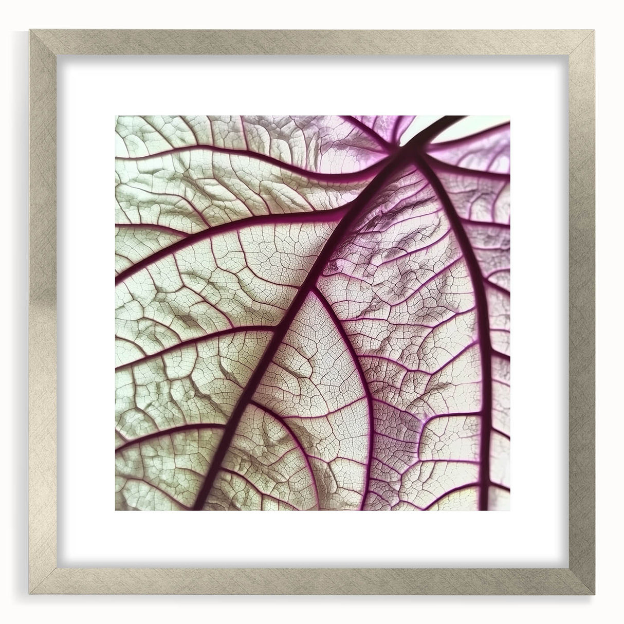 Textured art print of abstract leaves in muted green and brown, framed in silver, suitable for bedroom decor.