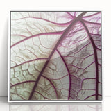 Close-up of green leaves portrayed in a modern art style on a white acrylic framed poster, suitable for nursery wall decor.