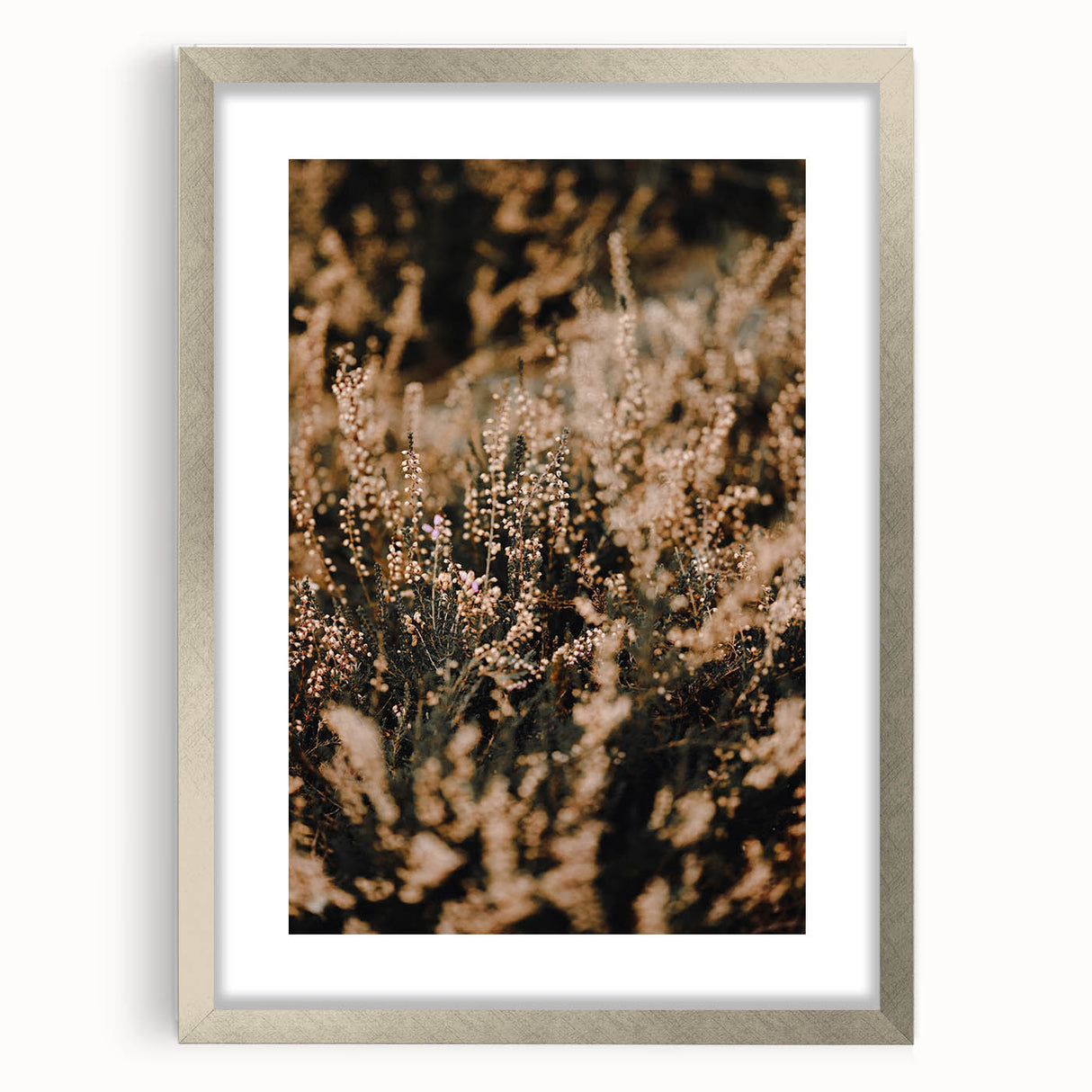 Textured abstract art print depicting autumnal colors on a silver-framed mat, suitable for bedroom decor.