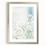 Textured abstract art print depicting spring, with vibrant green and yellow hues, in a silver frame, ideal for bedroom decor.