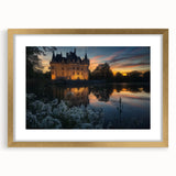 Gold-framed landscape artwork featuring a majestic castle scene, accented by a stylish mat, perfect for home decor enthusiasts seeking elegance and charm.