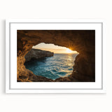 Framed landscape artwork depicting a serene cave scene, featuring a white mat and elegant frame, ideal for home decor or office settings, enhancing interior aesthetics.