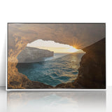 Framed acrylic artwork showcasing a vibrant landscape scene with intricate cave formations and vivid colors, set in a sleek white frame for modern decor.