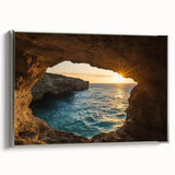 Framed canvas artwork depicting a serene landscape with caves, featuring a silver frame and a side view that highlights the texture and colors of the scene. Ideal for home decor.