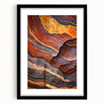 Framed landscape art print showcasing dramatic cliffs, set in a sleek black frame with a white mat, enhancing the natural beauty of the scene. Perfect for home decor.