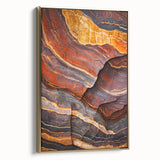 Framed canvas artwork of a dramatic cliff landscape in gold and earthy tones, showcasing intricate details and textures, perfect for enhancing modern decor.