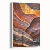 Framed canvas artwork depicting a stunning coastal landscape with dramatic cliffs and vibrant blue ocean waves, showcased from a white side view perspective. This piece adds a serene touch to any interior decor.