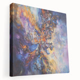 Abstract splatter art on a stretched canvas, showcasing vibrant colors like blue, yellow, and red, ideal for modern home decor or creative spaces.