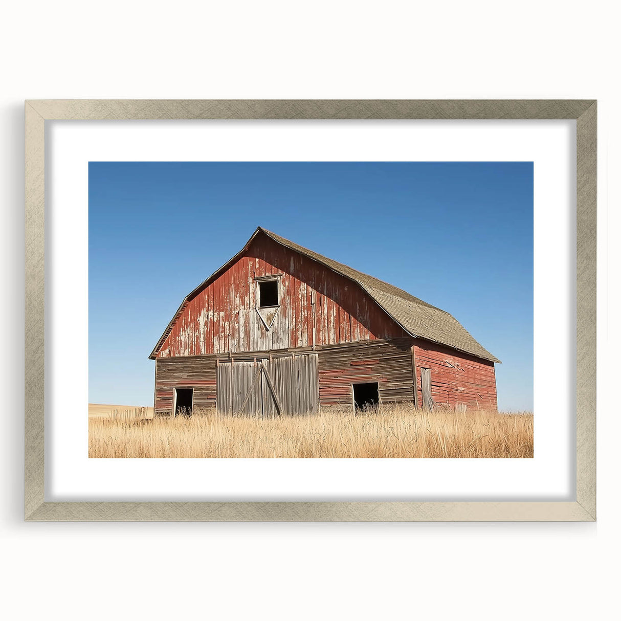 Silver-framed landscape barn design artwork with a white mat, showcasing a serene countryside scene. Ideal for home decor, this piece enhances rustic interiors.