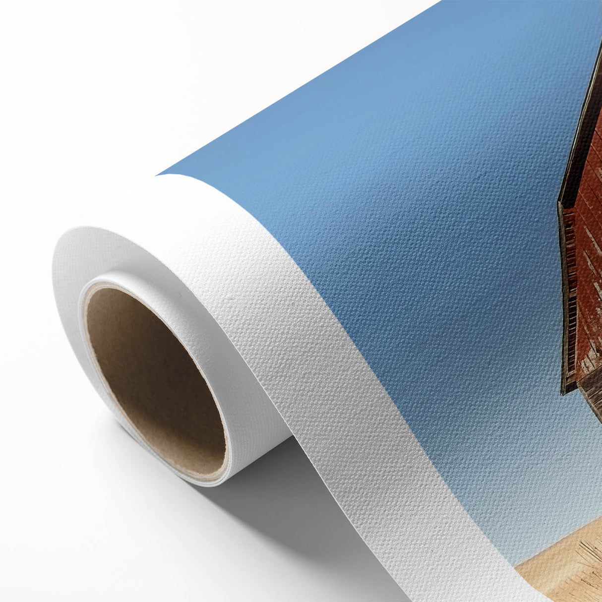 Rolled landscape canvas showcasing a vibrant barn scene with rich colors and detailed textures, carefully packaged in a protective cardboard tube for safe shipping. Perfect for home decor enthusiasts seeking rustic charm.