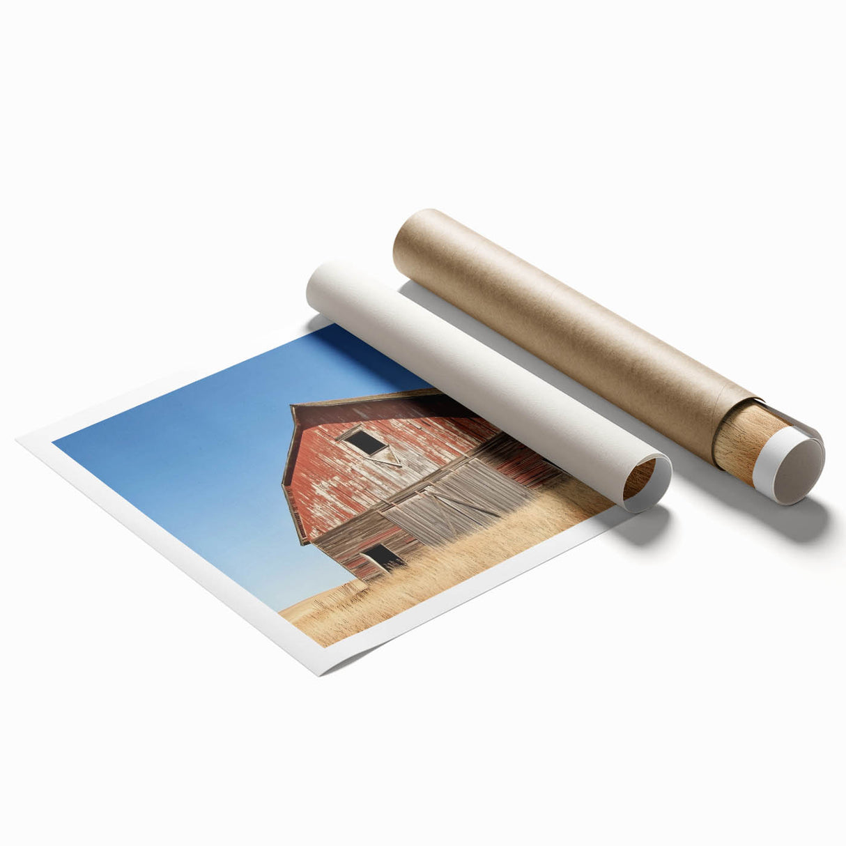 Rolled landscape art print showcasing a serene barn scene with vibrant colors and intricate details, securely packaged in a protective cardboard tube for shipping.