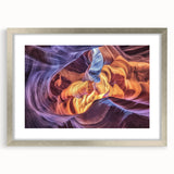 Landscape print of a canyon scene framed in silver with a white mat, showcasing rich earthy tones and dramatic rock formations, perfect for home decor.