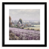 Black-framed landscape wall art depicting a serene countryside scene, featuring lush green fields and a clear blue sky, perfect for home decor enhancement.