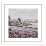 Landscape wall art framed in white with a mat, showcasing a serene countryside scene featuring lush green fields and a blue sky, perfect for home decor.