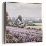 Framed landscape wall art depicting a serene countryside scene with lush green fields and a clear blue sky, featuring a sleek silver frame that enhances its elegance.