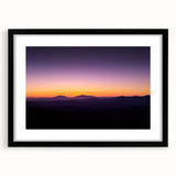 Front view of a black-framed desert landscape print with a white mat, showcasing warm earth tones and intricate details, perfect for home decor.