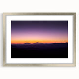 Desert landscape artwork framed in a sleek silver mat, showcasing vibrant hues of orange and yellow, ideal for modern home decor and wall enhancement.