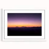 Desert landscape framed artwork with a white mat, showcasing vibrant colors and intricate details, perfect for home decor in a modern setting.