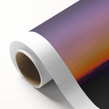 Desert landscape rolled canvas artwork showcasing vibrant hues of orange and yellow, depicting a serene sunset over arid dunes, ideal for home decor.