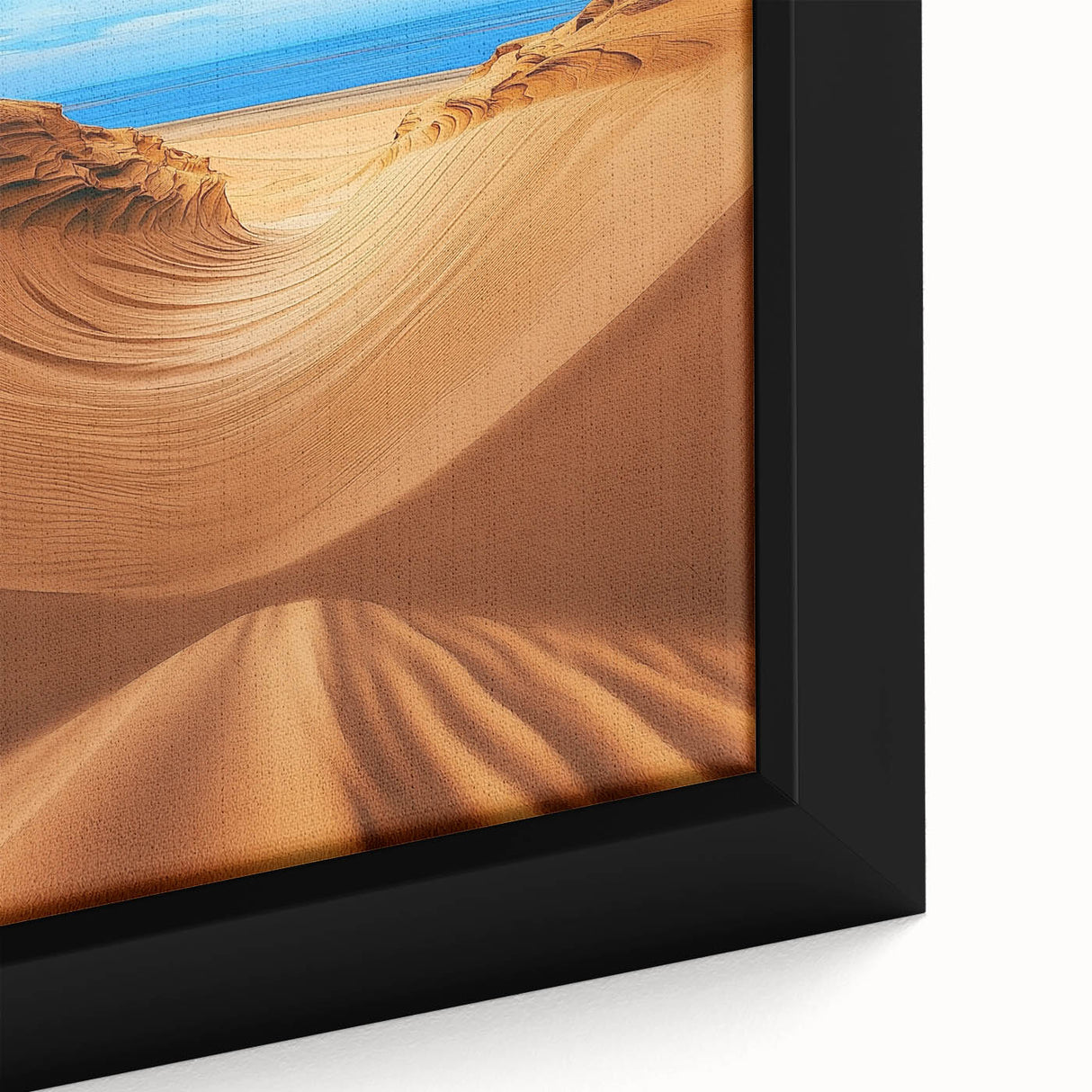 Close-up of a framed canvas artwork depicting serene sand dunes under a blue sky, showcasing warm beige and golden tones, perfect for modern home decor.