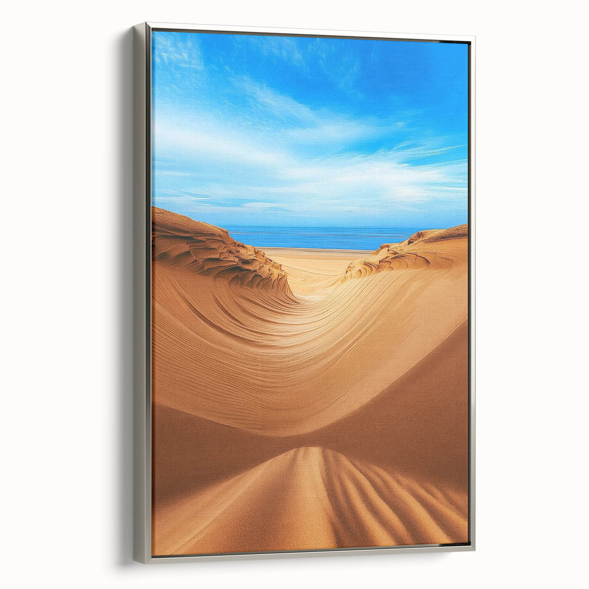 Framed canvas artwork showcasing a serene landscape of rolling sand dunes, elegantly displayed with a silver frame, perfect for enhancing modern home decor.