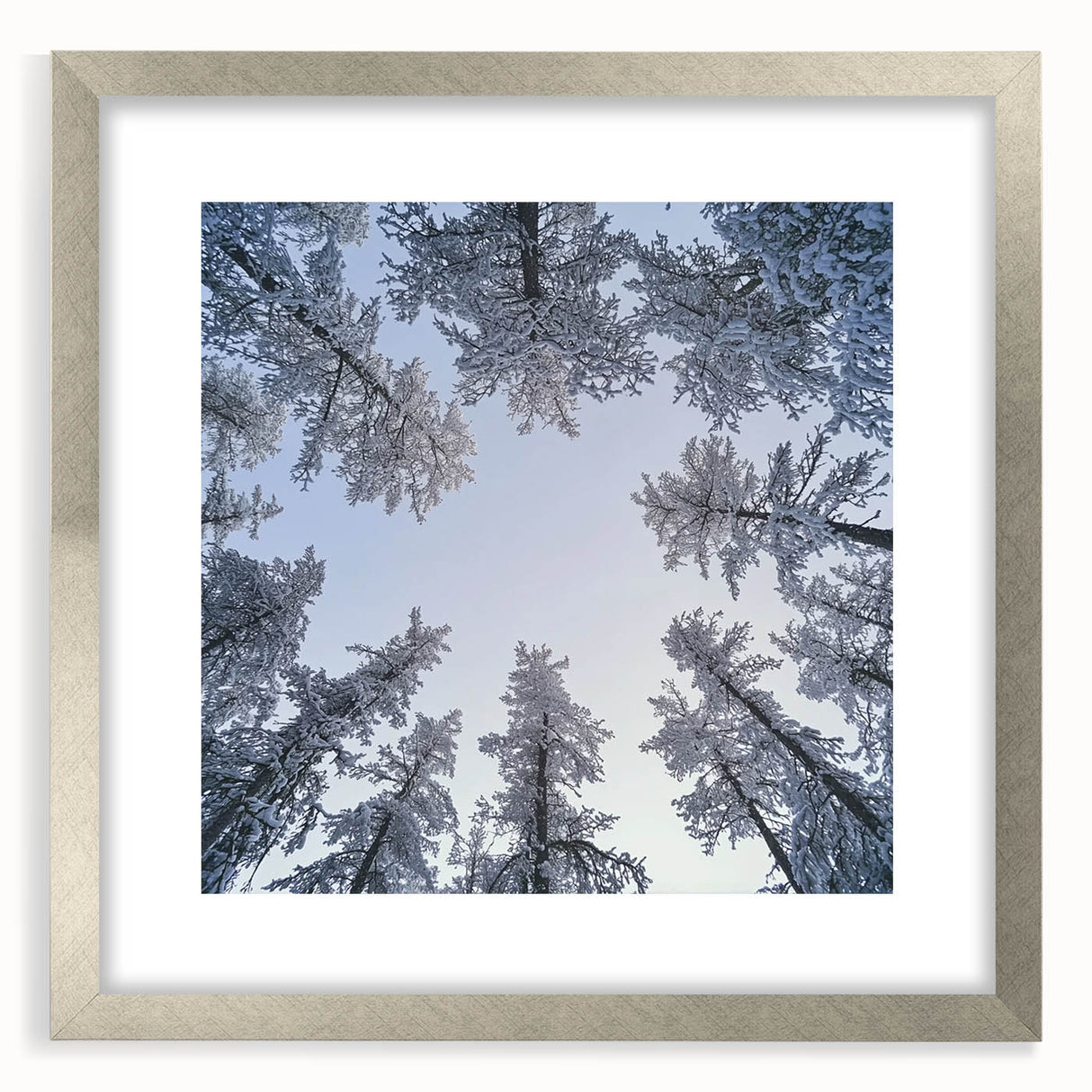 Textured art print featuring abstract icy patterns in muted gray and blue tones, framed with a silver mat.