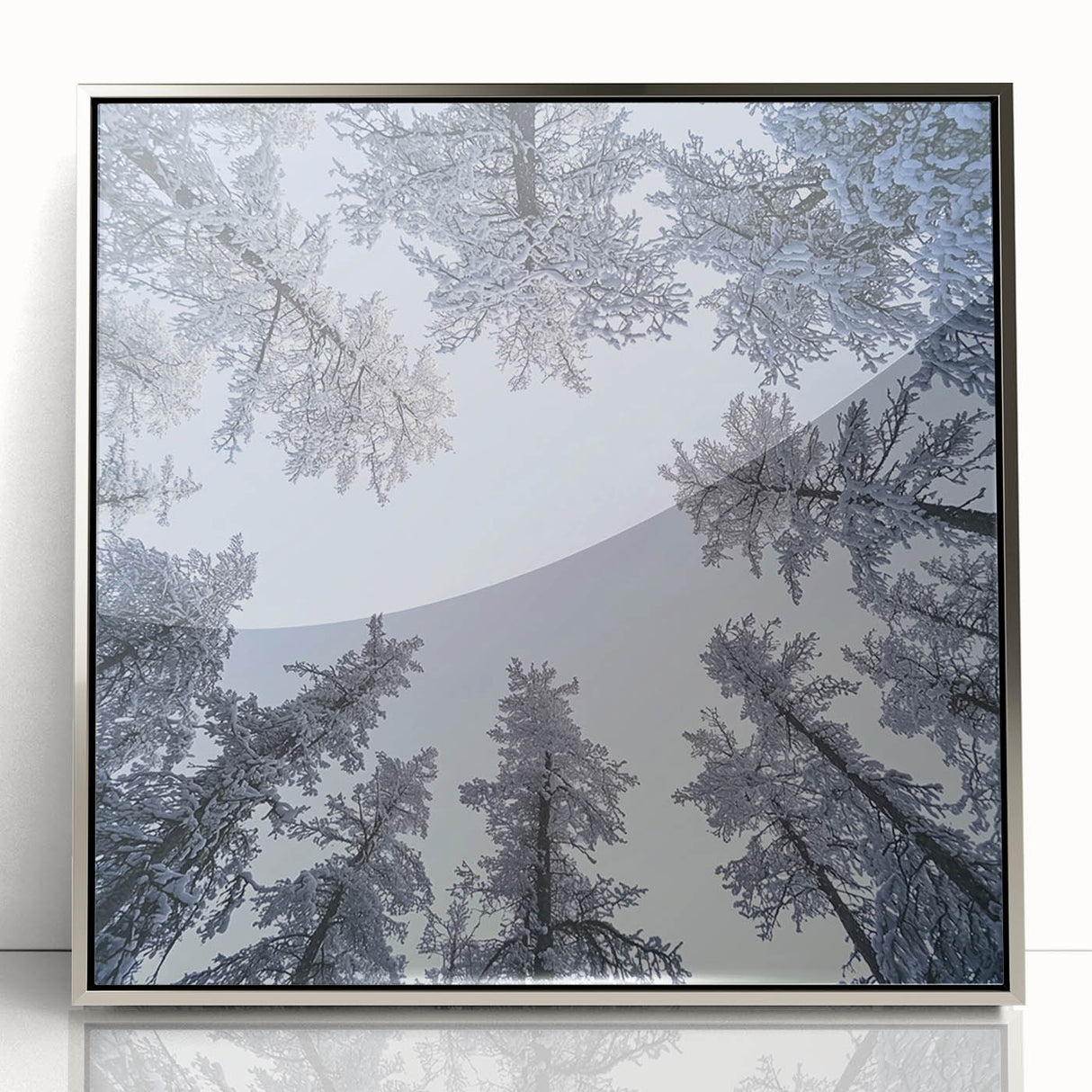 Mid-century modernist art featuring close-ups of icicles and frost in muted gray tones, framed in silver acrylic.