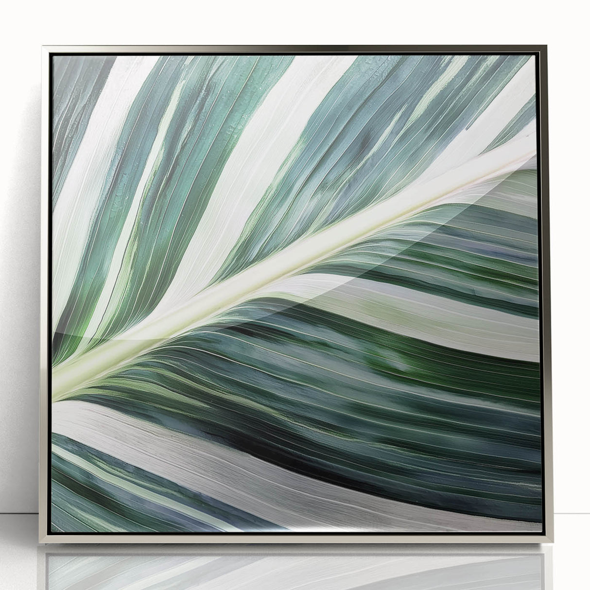 Mid-century modernist art depicting close-up green leaves, silver-framed acrylic, ideal for nursery wall art.