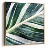 Framed canvas featuring close-up of leaves in silver and gold, ideal for bedroom wall art.