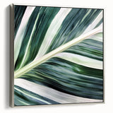 Close-up landscape art painting of leaves, rendered in vibrant green and silver tones on a framed canvas.