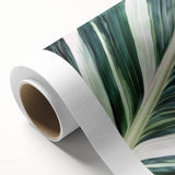 Art deco poster of close-up leaves in green and yellow tones on rolled canvas, suitable for nursery wall art.