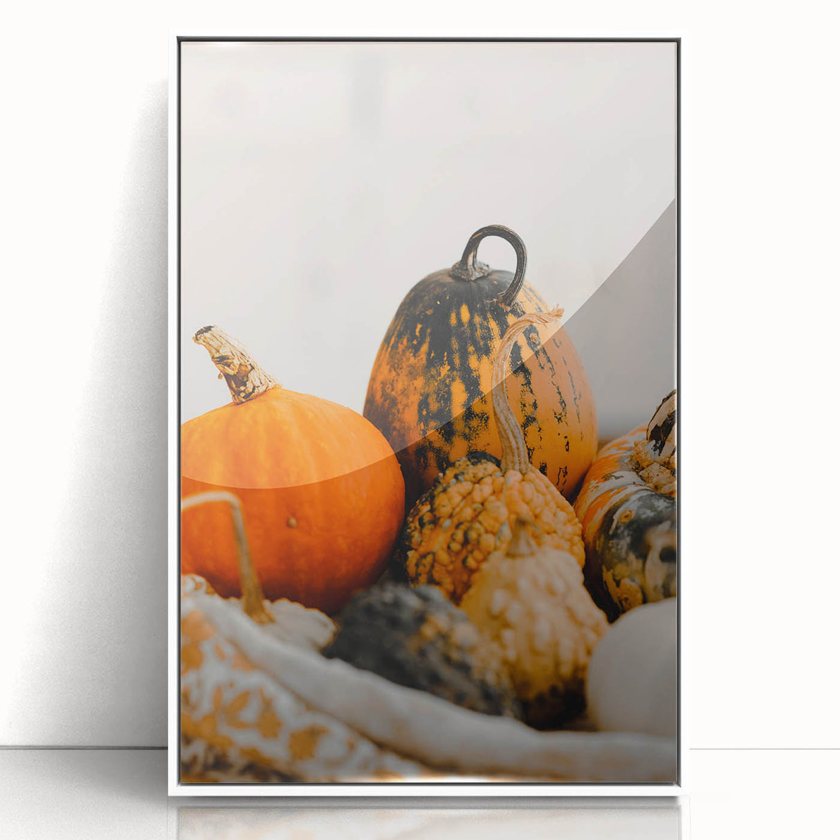 Art deco poster featuring a stylized fall scene with orange and brown hues, framed in white acrylic.