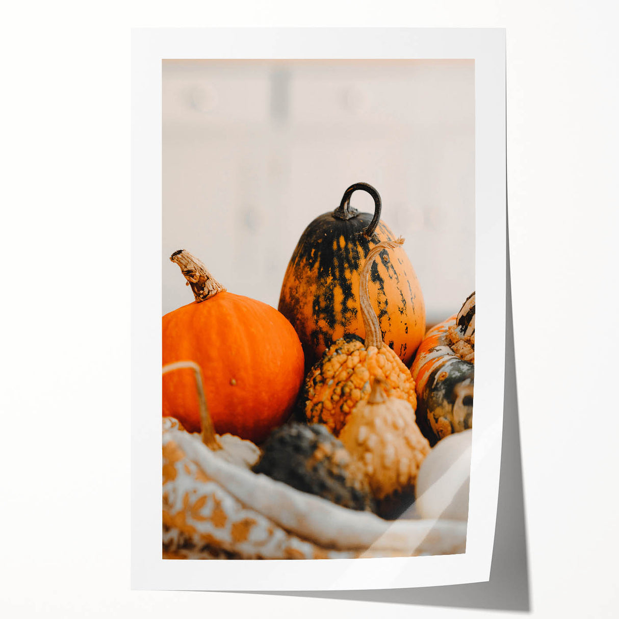 Rolled print of autumnal trees in warm orange and red tones, suitable for art wall dining room.