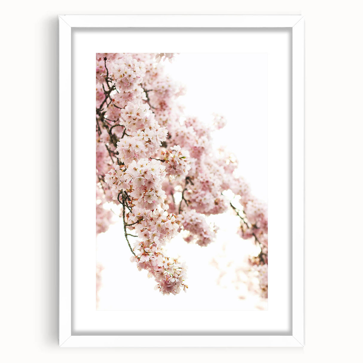 Abstract art print depicting spring season in pastel shades, framed in white, suitable for bedroom or dining room decor.