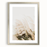 Textured abstract art print in silver frame, featuring swirling summer hues, ideal for modern bedroom decor.