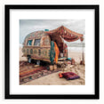 Extra large abstract art print featuring a colorful textured caravan, in a black frame with mat, ideal for living room decor.