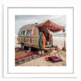 Abstract art print featuring a colorful caravan design in a white frame, suitable for dining room decor.